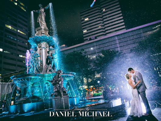 Couple standing next to fountain